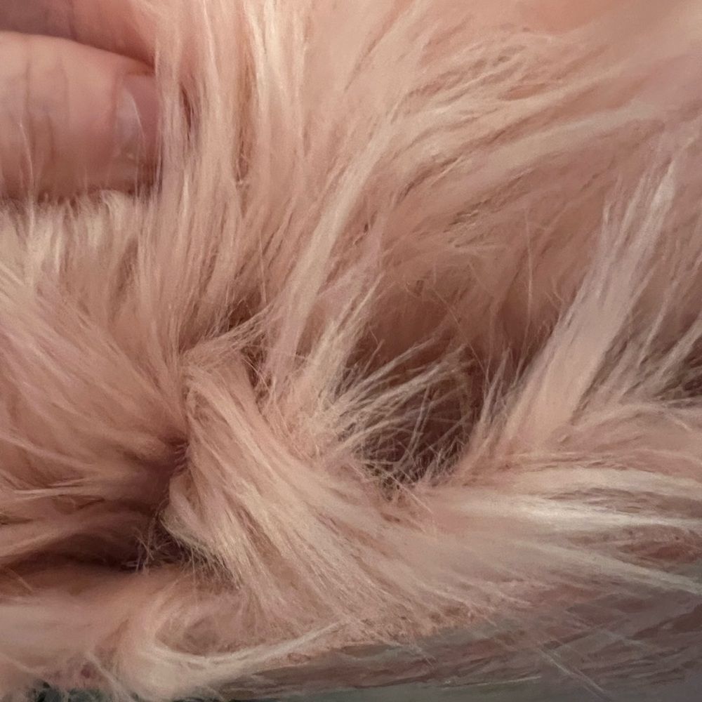 Pink furry small area rug
